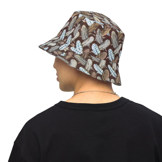 Bucket hat featuring Feather Mark logo on one side and a bold eagle-inspired print on the other, honoring Jackie and Shadow of Big Bear Lake