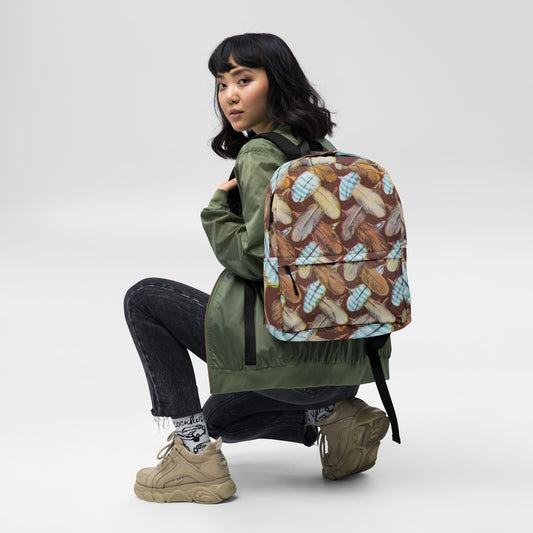 Feather Mark backpack with laptop sleeve and water-resistant design, inspired by Jackie, Shadow, Sunny, and Gizmo from Big Bear Valley.