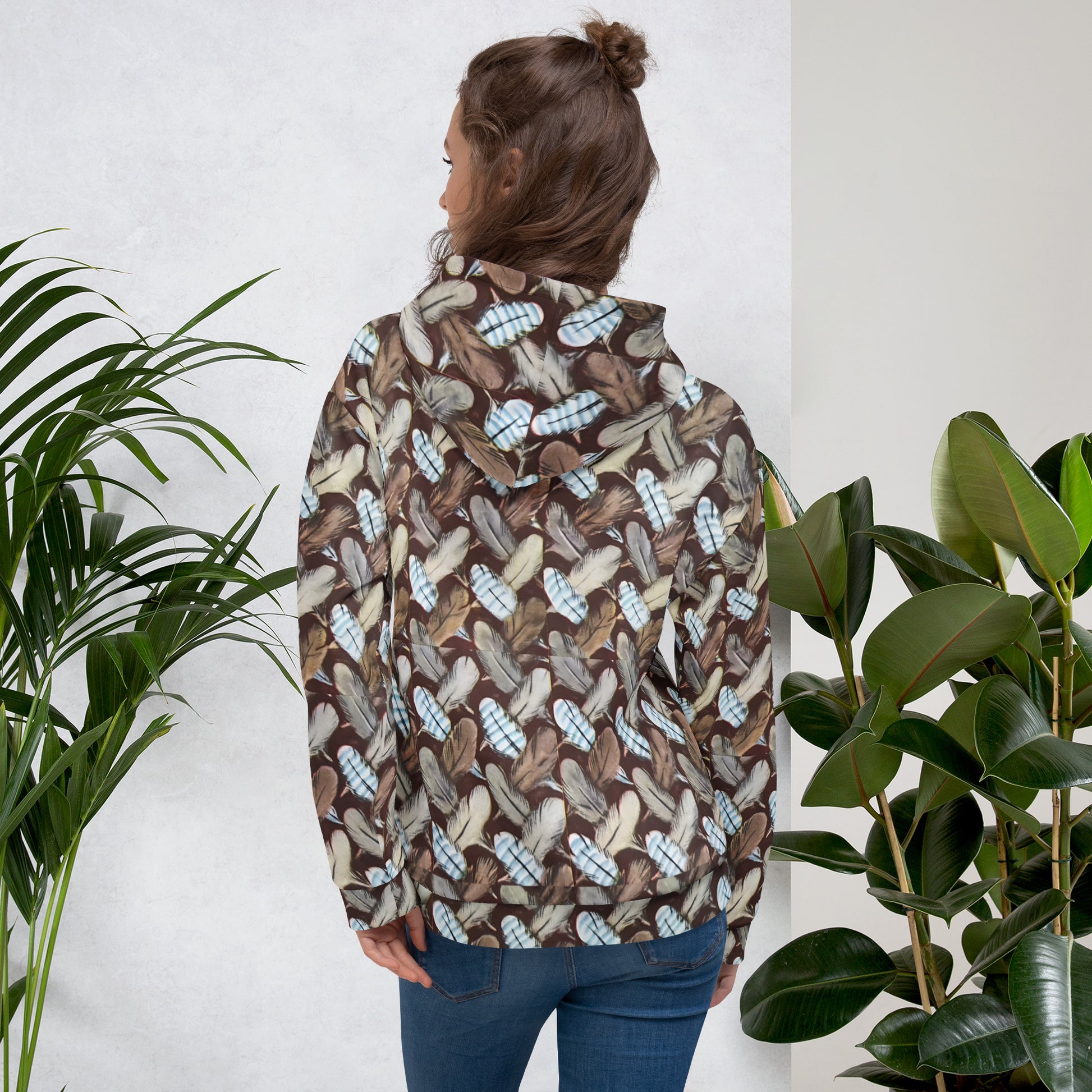 Feather Mark unisex hoodie with all-over feather design, soft fleece interior, inspired by Jackie, Shadow, Sunny, and Gizmo from Big Bear Valley.