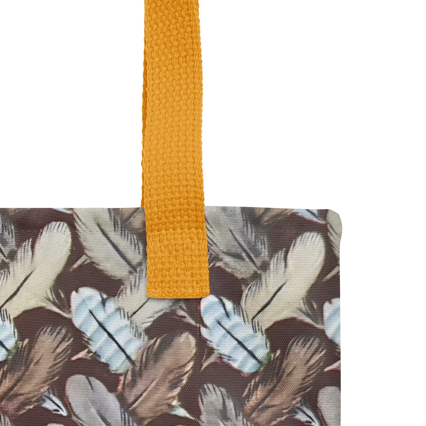 feather patterned tote with a yellow strap on a white background