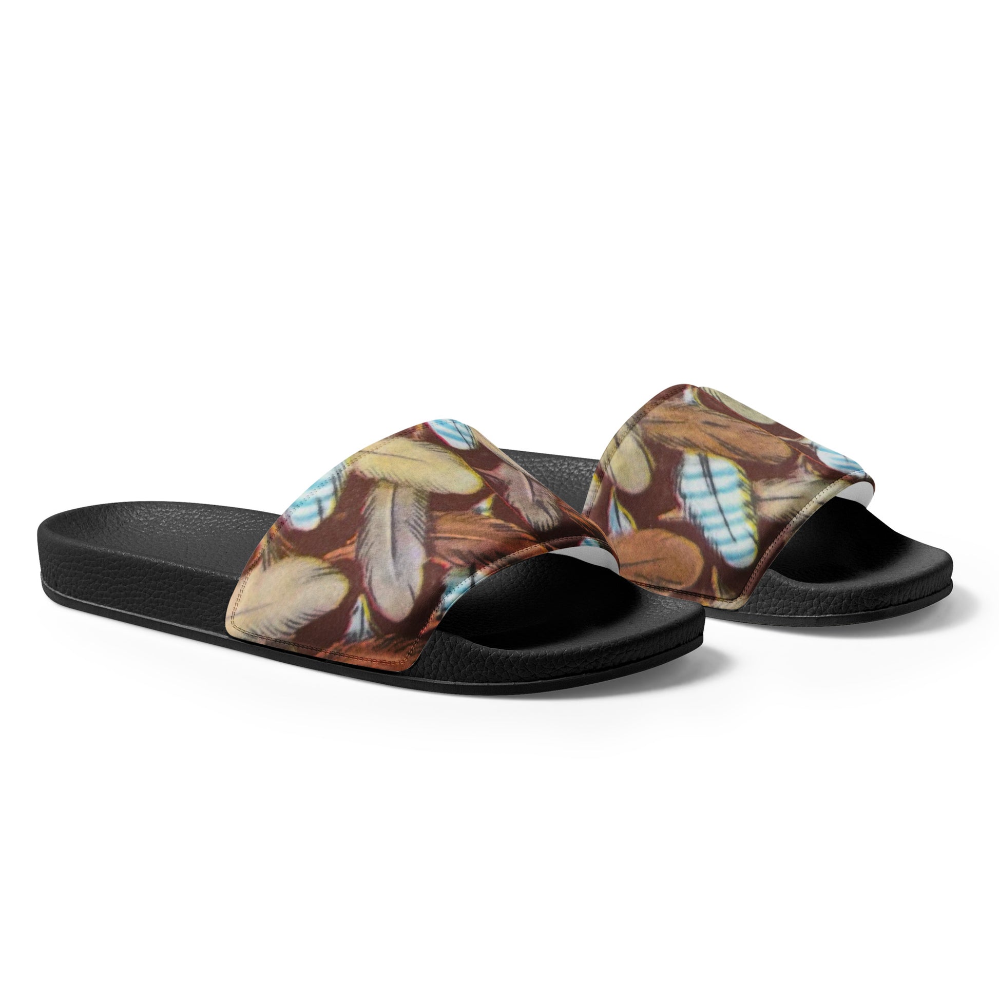 Pair of sandals with feather pattern on a white background