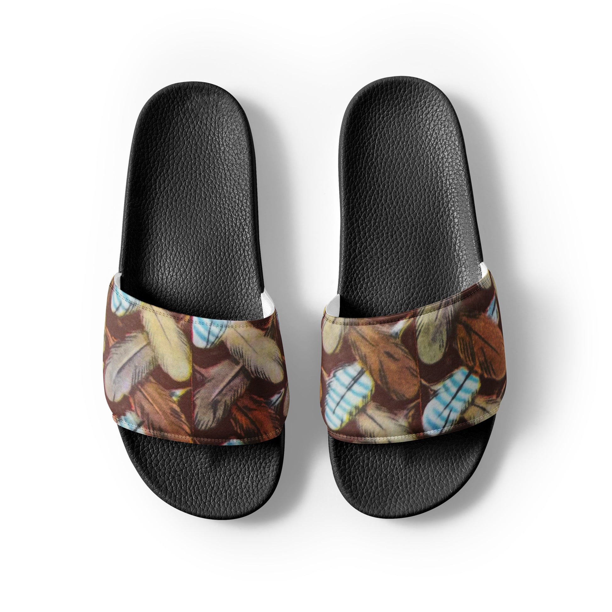 Pair of slide sandals with feather pattern on a white background