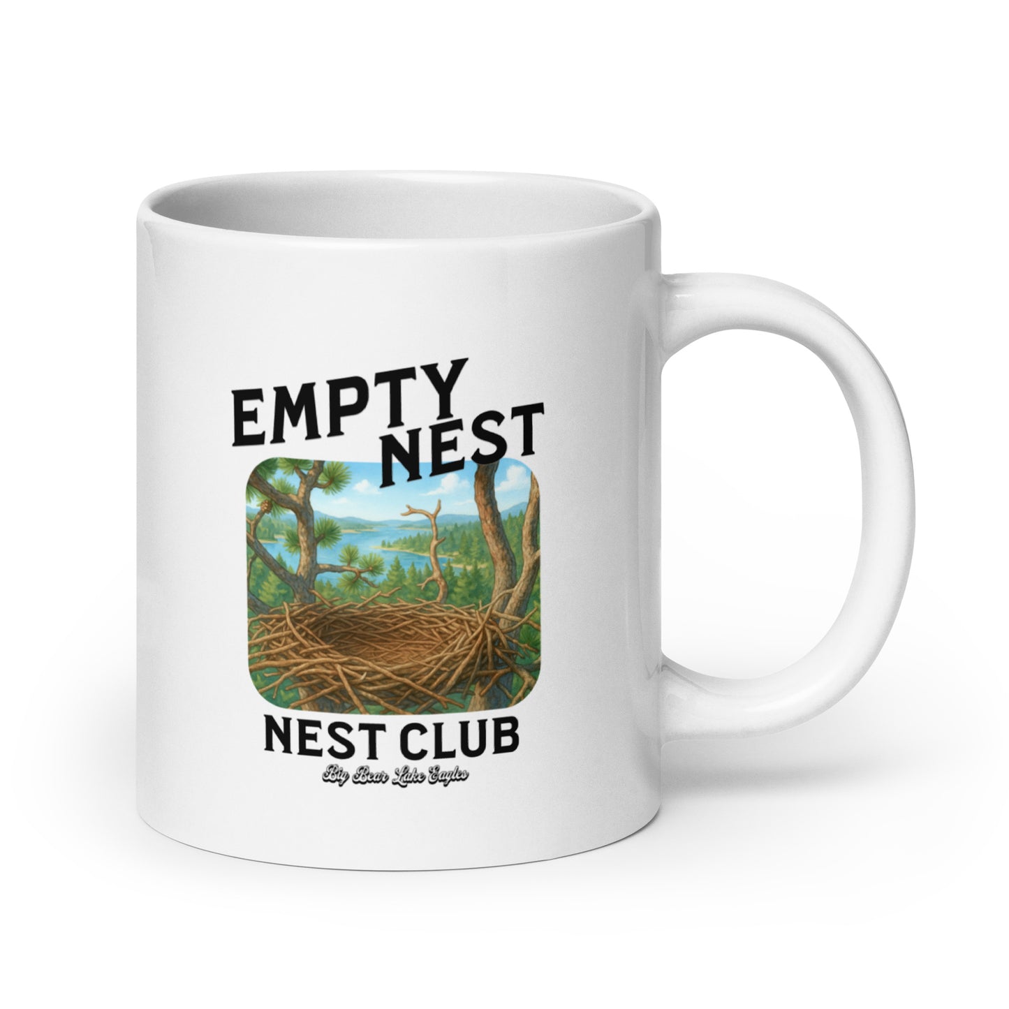 White ceramic mug with ‘Empty Nest Nest Club’ printed above an illustration of an empty bird’s nest perched high above a forest and lake. The design is playful and peaceful, evoking nature, quiet mornings, and birdwatching vibes.