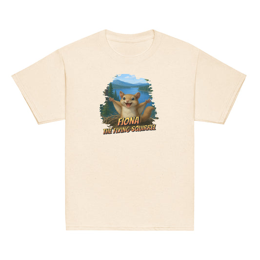 Youth t-shirt featuring Flying Fiona the squirrel in mid-glide near Jackie and Shadow’s nest in Big Bear Valley, on a tan background.