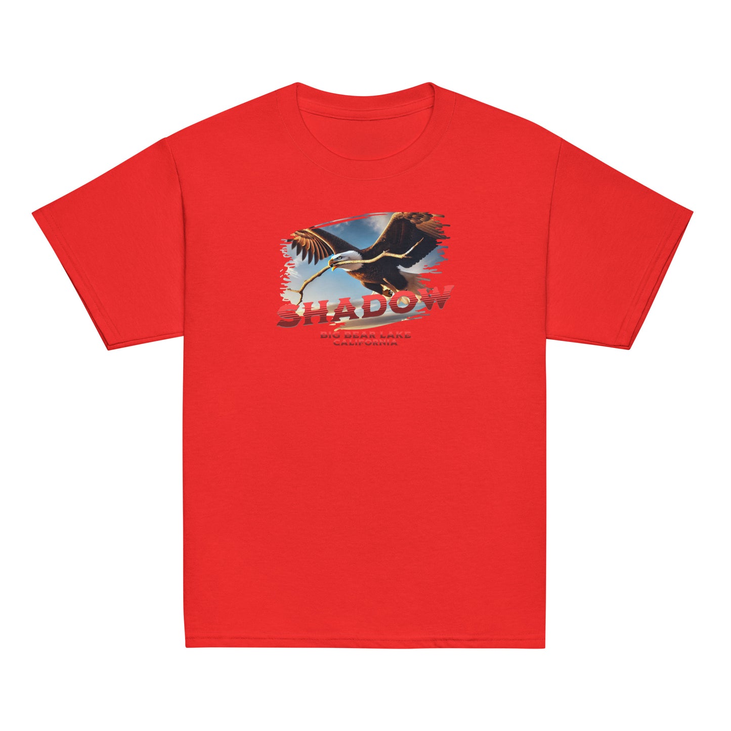 Youth t-shirt featuring Shadow the bald eagle flying with a stick in his beak over Big Bear Valley, inspired by his nest-building for Jackie.