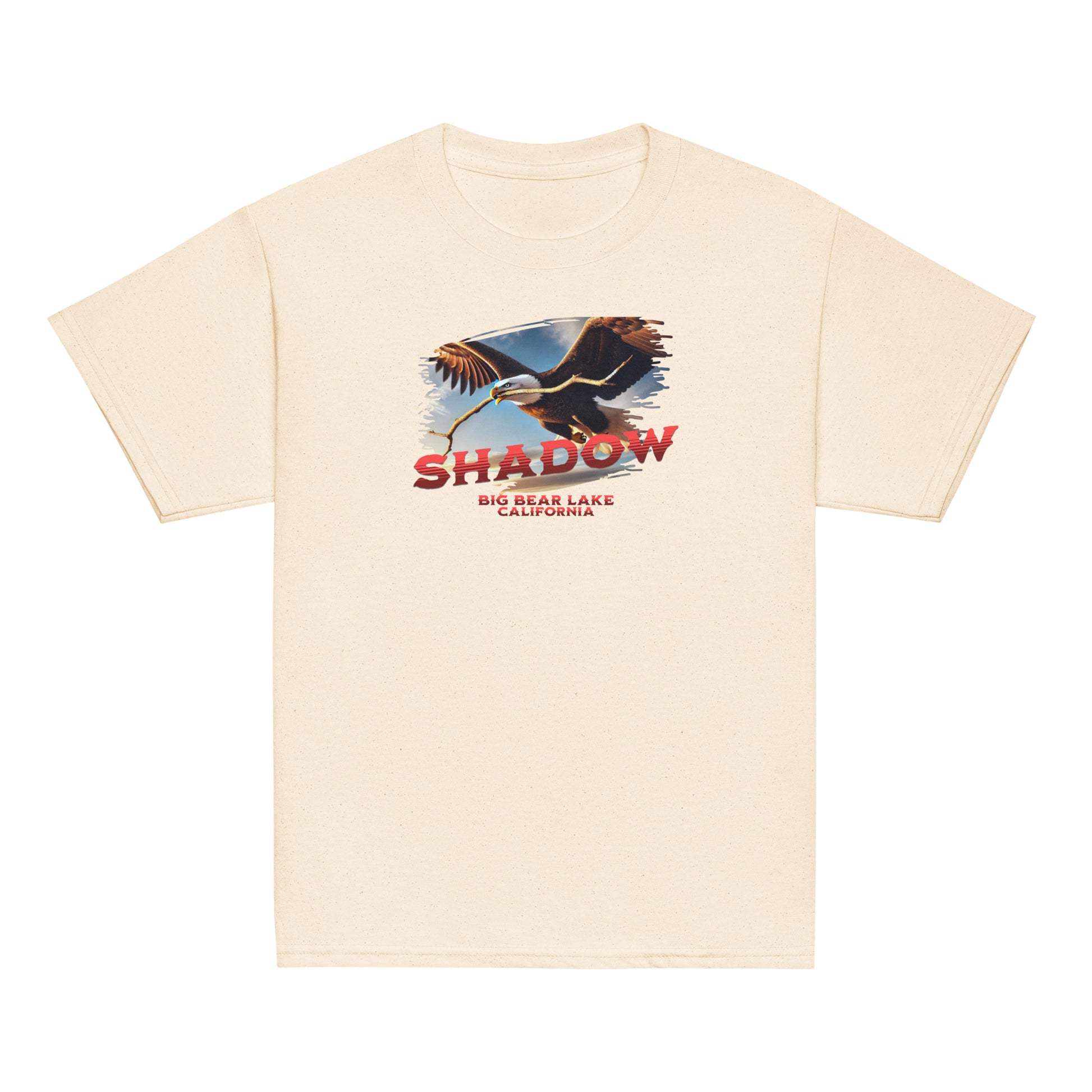 Youth t-shirt featuring Shadow the bald eagle flying with a stick in his beak over Big Bear Valley, inspired by his nest-building for Jackie.